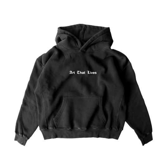 Black oversized hoodie with 'Art That Lives' text on the front.
