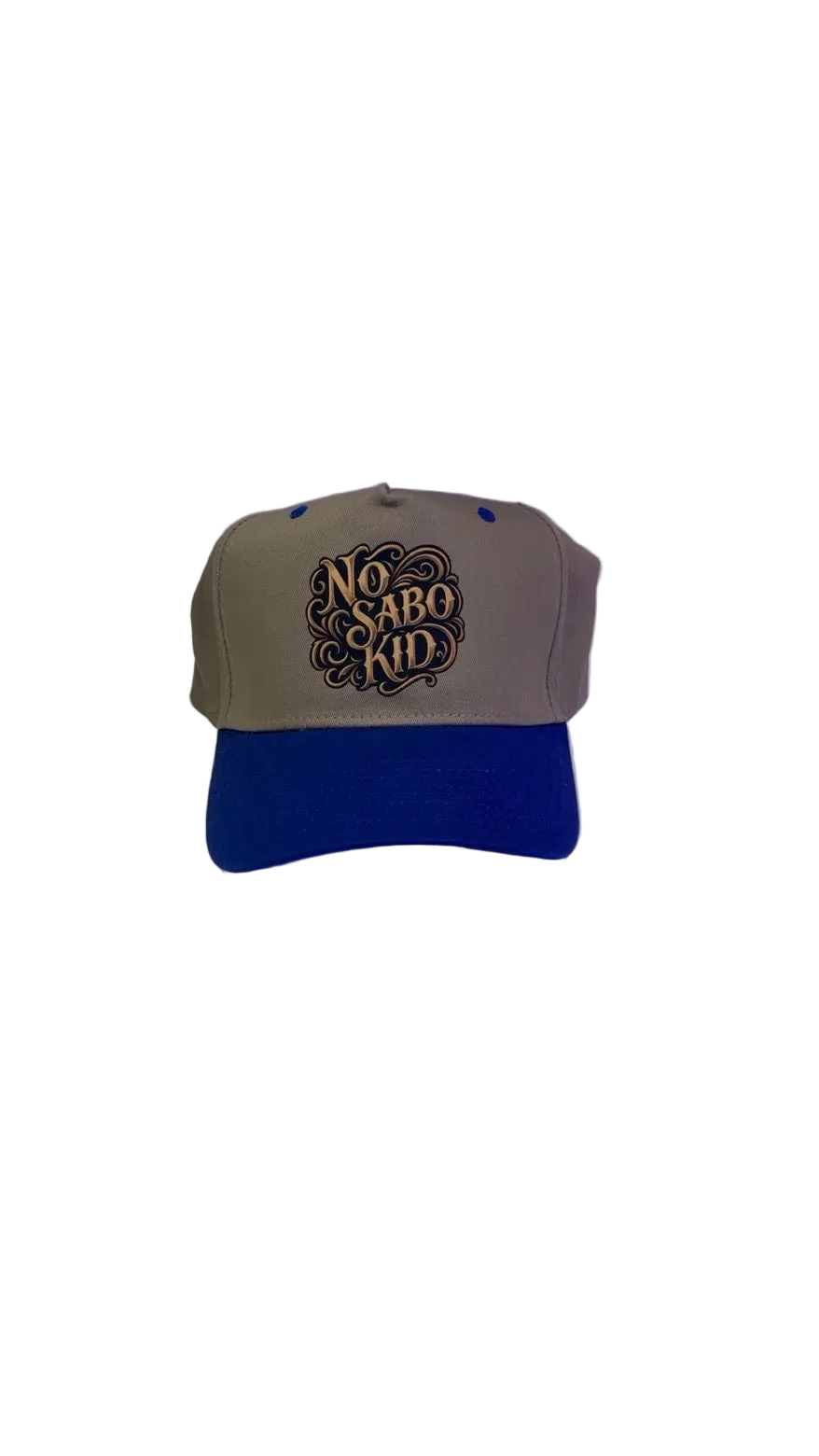 Beige and blue cap with 'No Sabo Kid' text on a white background