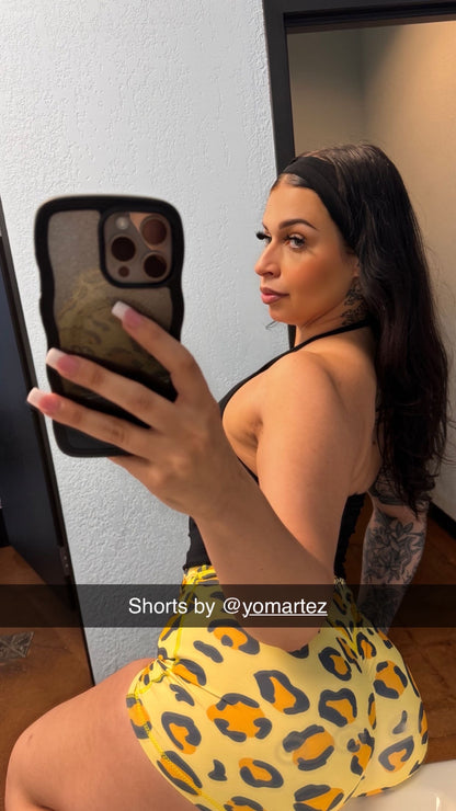 Selfie of YO! MARTEZ ATHLETICS
Cheetah Girlz — featuring navy blue and orange leopard print pattern, with 'YO! MARTEZ ATHLETICS' printed across the waistband.
