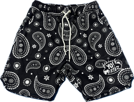 Black shorts with white paisley pattern on a white background