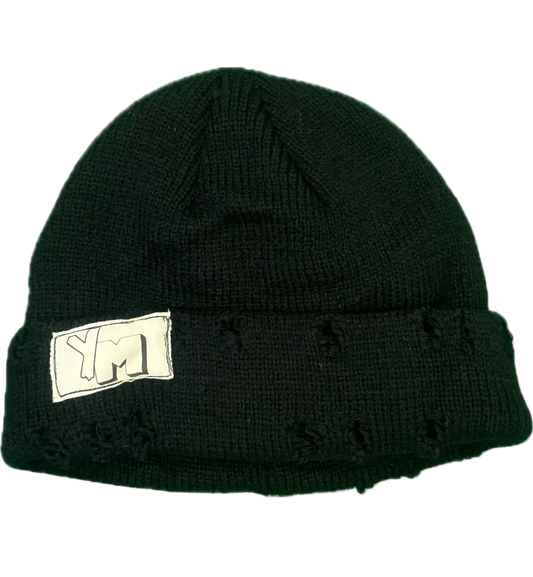 Black knit beanie with a white logo on a white background