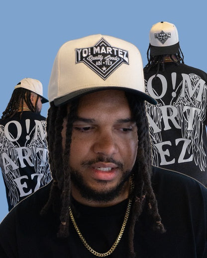 Model styling black embroidered
"Yo! Martez Quality Goods" hat