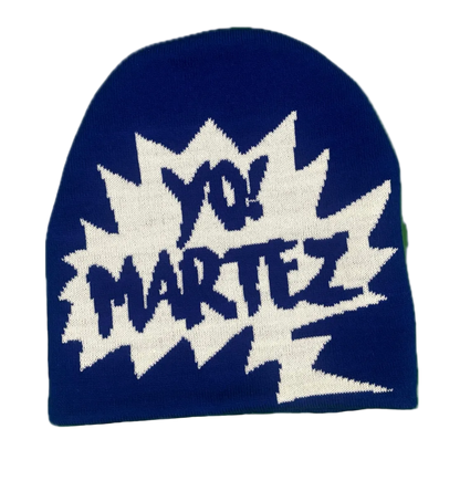 A navy blue knit beanie featuring a large white comic-style burst with the text 'YO! MARTEZ' in navy blue lettering, shown against a plain white background.