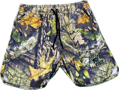 camouflage shorts with a green and black 'Yo! Martez' logo patch on the front leg