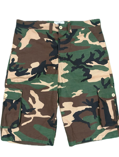 A pair of camouflage cargo shorts with green, brown, black, and beige camo pattern, featuring side cargo pockets and a button closure.