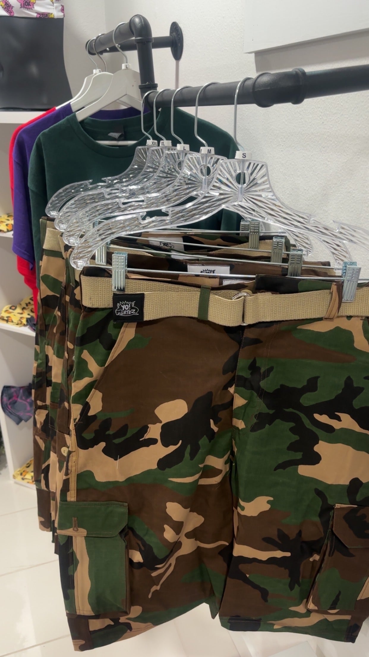 YO! MARTEZ camouflage cargo shorts with a tan belt.