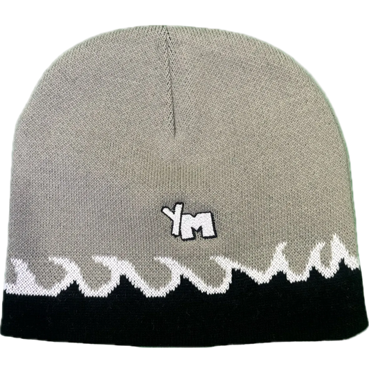 Gray beanie with white lace edge and 'YM' logo on a white background