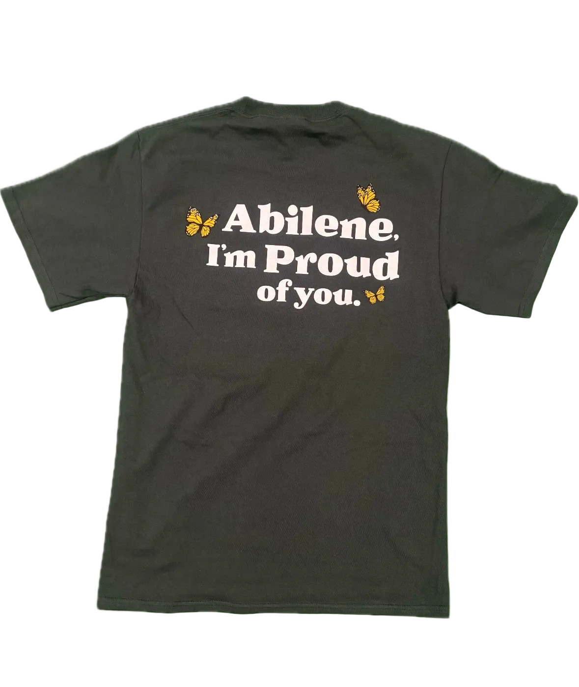 A dark charcoal gray t-shirt shown from the back, featuring the text 'Abilene. I'm Proud of you.