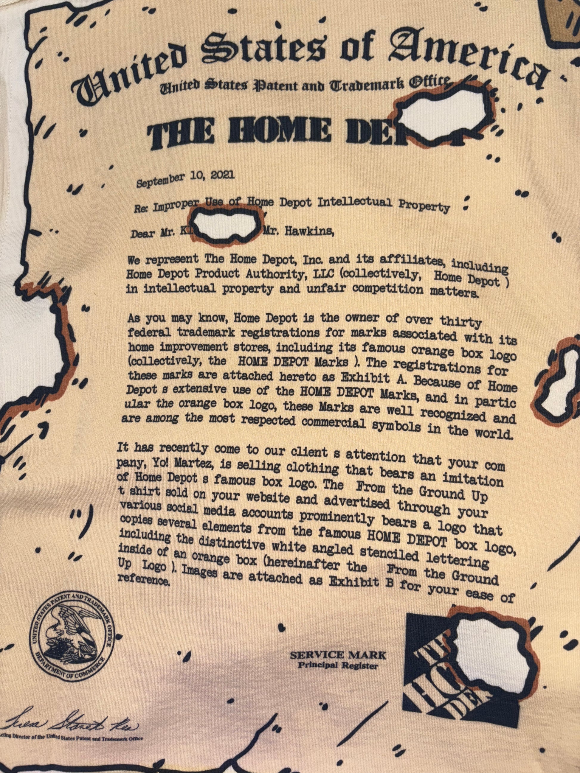 Close up shot, of the real Cease & Desist from Home Depot ( sent to Martez Hawkins Owner of Yo! Martez) recreated by Yo! Martez with real legal documentation present as the design scroll on the back 