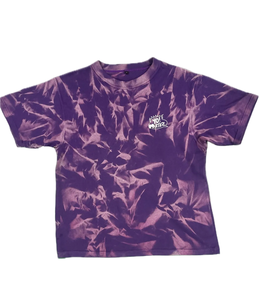 A purple and magenta tie-dye short-sleeve t-shirt with a small white graphic on the left chest, displayed flat against a white background.