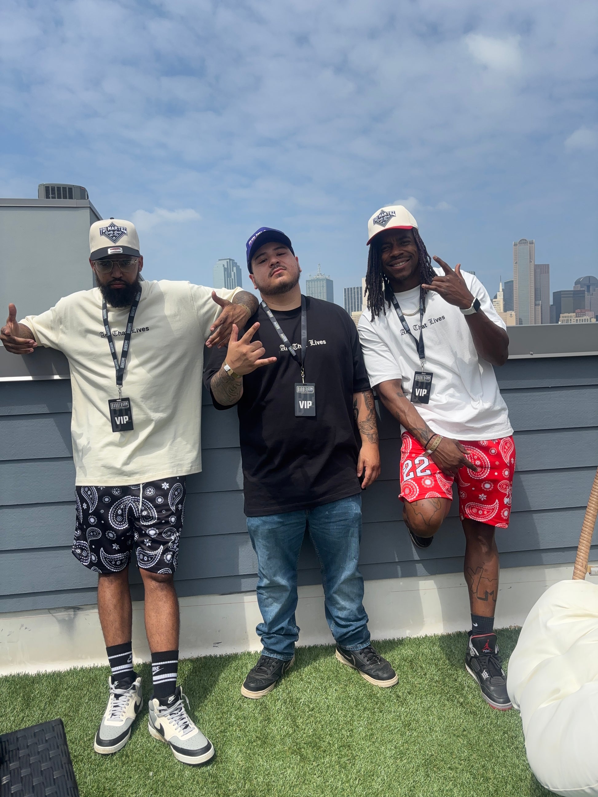 Styling the red & black embroidered
"Yo! Martez — Quality Goods" hats