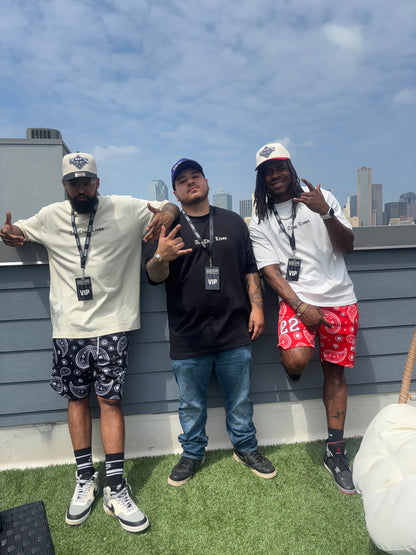 Styling the red & black embroidered
"Yo! Martez — Quality Goods" hats