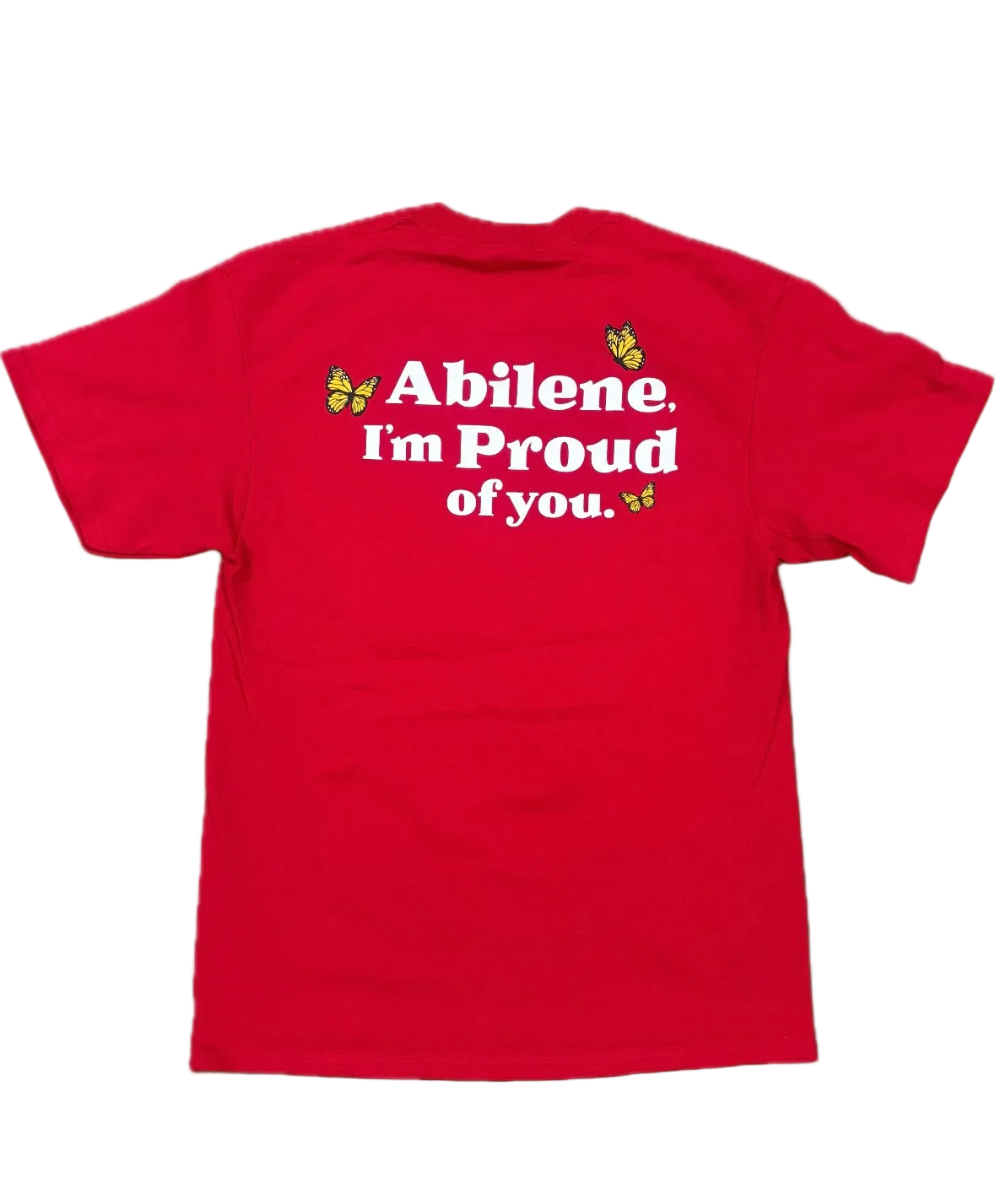 A red short-sleeve t-shirt shown from the back, featuring the text 'Abilene. I'm Proud of you.