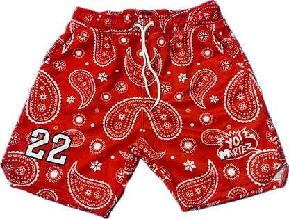 Red bandana patterned shorts with white accents on a white background