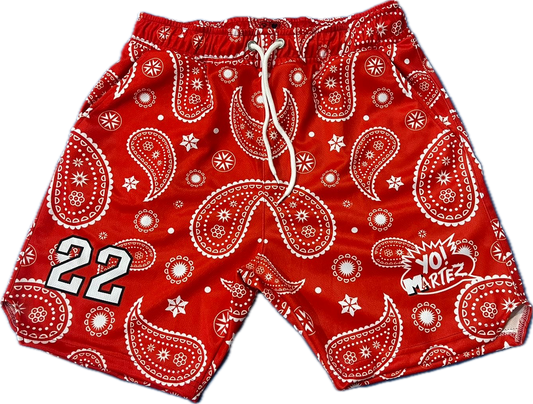 Red bandana patterned shorts with white accents on a white background