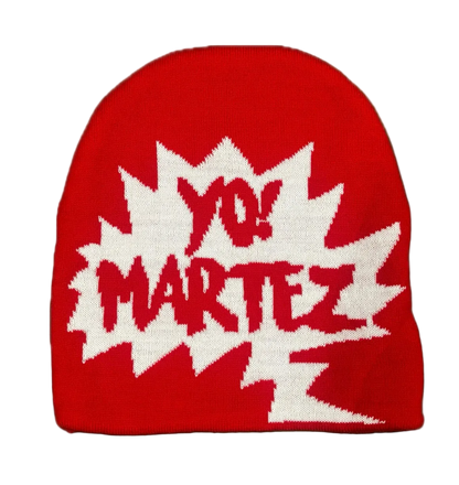 A red knit beanie hat featuring a large white starburst graphic with the text 'YO! MARTEZ' in red, shown against a plain white background.