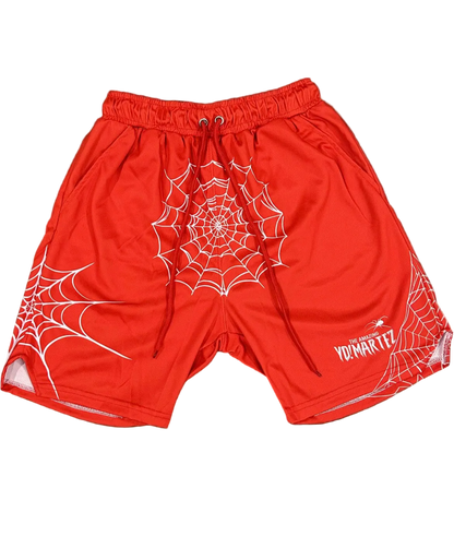 Red athletic shorts with a white spider web pattern and spider graphics on the legs, waistband, and a logo on the left leg.