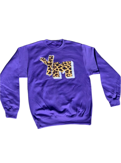 A purple sweatshirt with a YM cheetah print design on the front, featuring a crewneck and long sleeves.