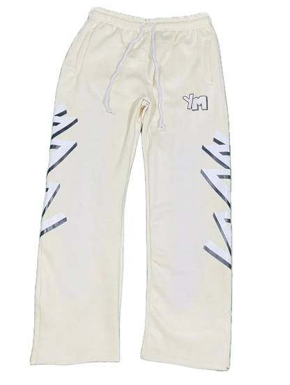 Cream color Yo! Martez sweatpants with black and white designs 