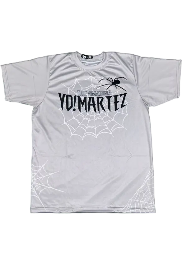 A blue athletic shirt with a spider graphic and the text 'YO! MARTEZ' on the front.